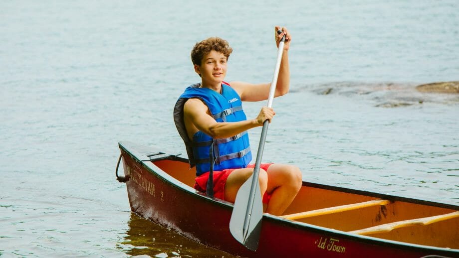 Boy canoeing on the lake