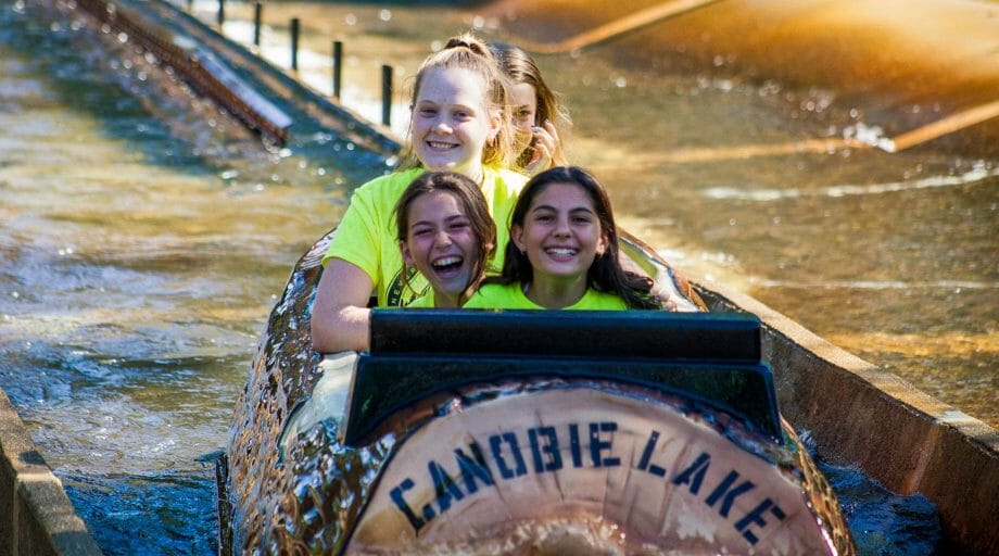 Campers on the log ride at Canobie Lake Park on an off-camp trip