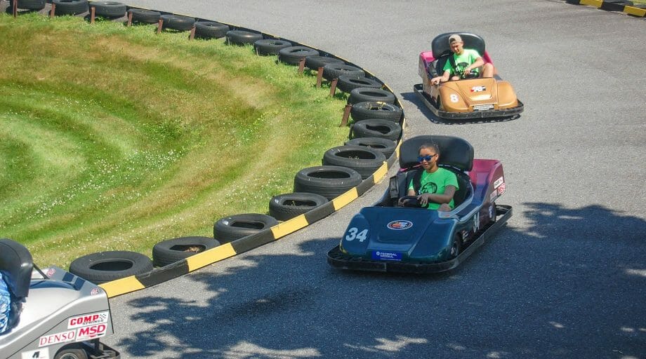 Campers go-karting at an off camp trip
