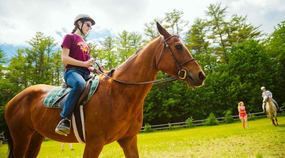 Camper horseback riding