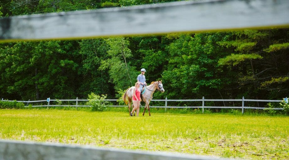 Camper riding a horse