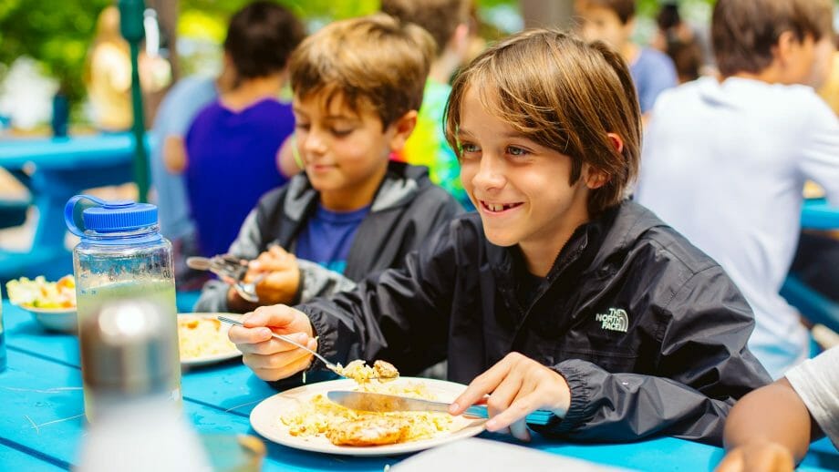 Boys eating lunch outside
