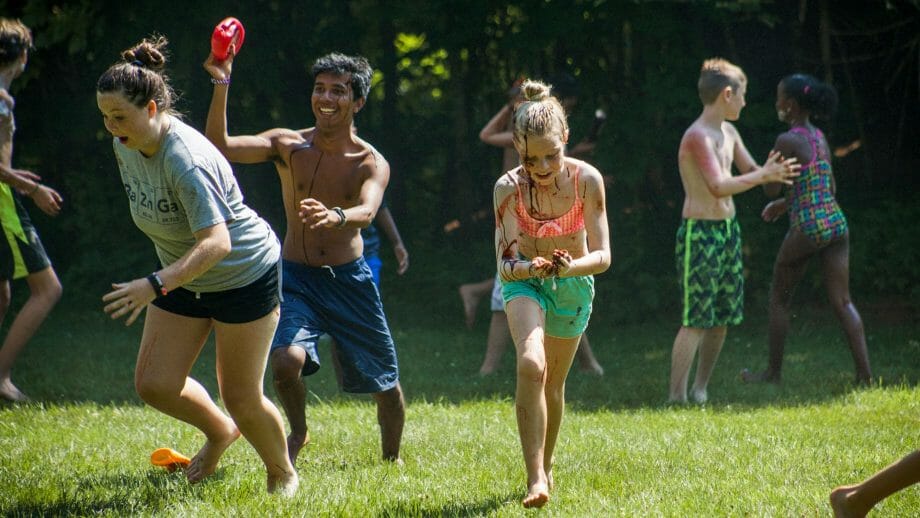 Campers running at Muck Fest