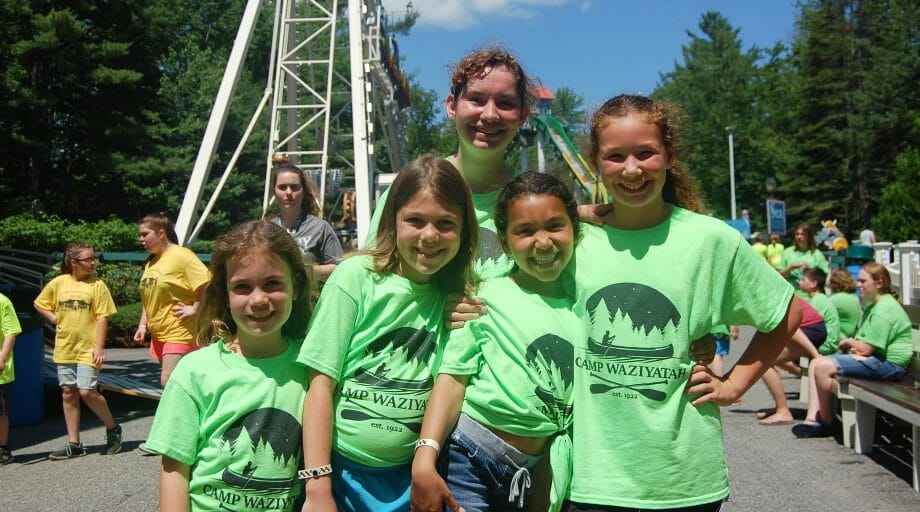 Kids at an amusement park at an off camp trip