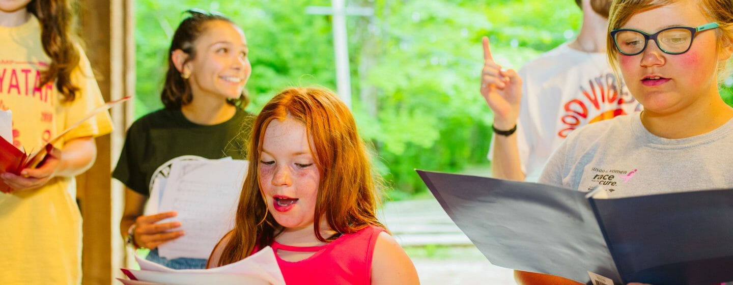 Girls singing for a performance