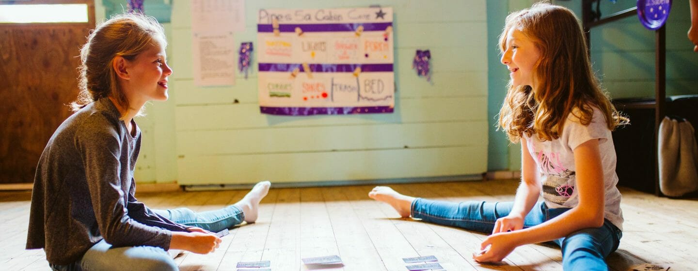 kids playing cards at summer camp