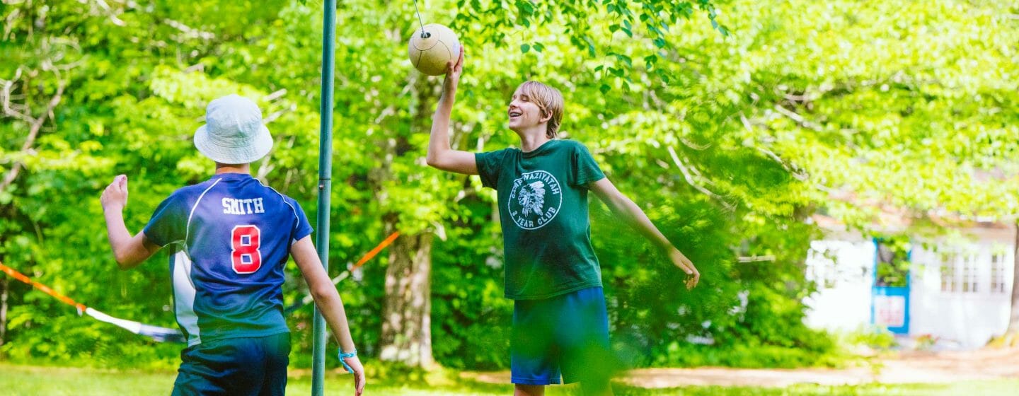 Male teens at tetherball