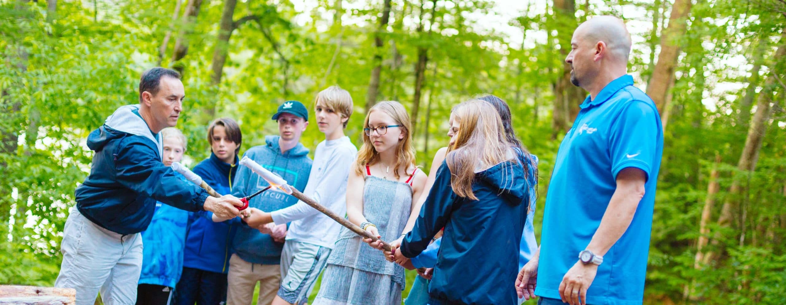 Directors and campers roasting marshmallows