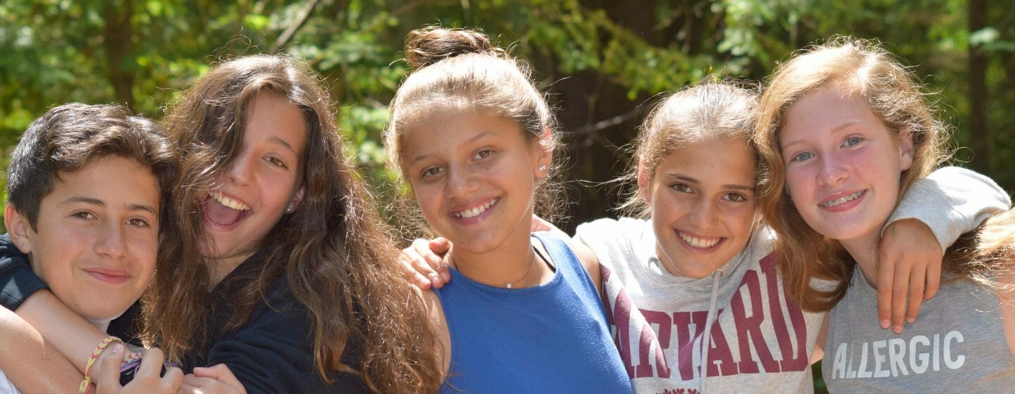 Four girls and one boys smiling